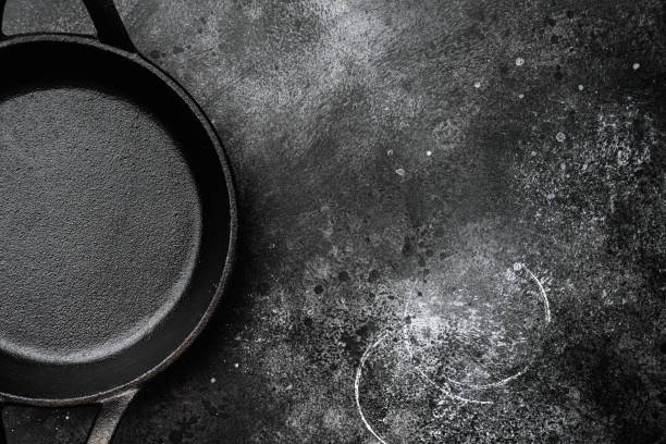 istock Empty cooking pot with copy space for text or food with copy space for text or food, top view flat lay , on black dark stone table background 1345516306