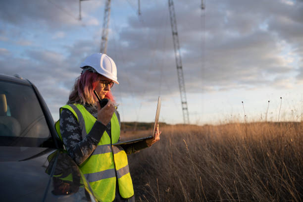 istock Female Electrical Engineer Is Working Outdoor. 1345516755