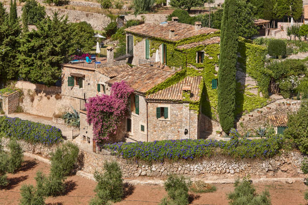 Traditional stone house surrounded by gardens in Valldemossa, Balearic islands stock photo