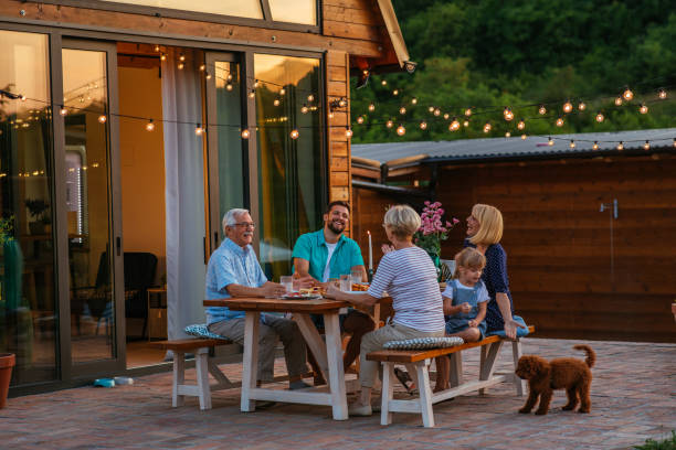 istock Family dinner around dining table in the garden 1345519294