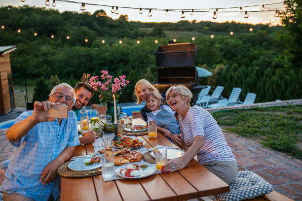 istock Family selfie at the dining table in the backyard 1345519301