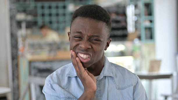 istock Portrait of Young  African Man having Toothache 1345519326