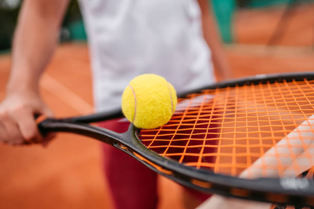 istock Unrecognizable man holding ball on tennis racket 1345520225