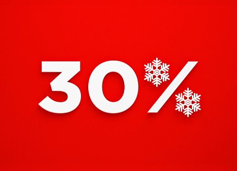 White snowflakes forming a percentage sign sitting next to number 30 on red background. Horizontal composition with copy space. Directly above. Great use for Christmas Sale concepts.