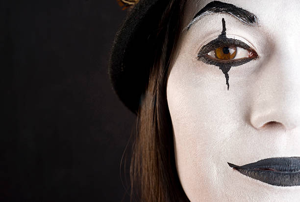 istock Half a Clown Face Pretty female in White Make Up 134552053