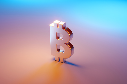 Símbolo de Bitcoin sentado sobre fondo rosa y azul photo