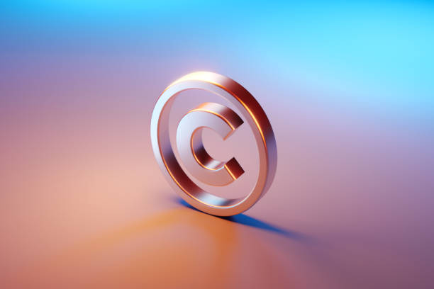 Copyright Symbol Sitting Over Pink And Blue Background Copyright symbol sitting over pink and blue background. Selective focus. Horizontal composition with copy space. High angle view. trademark stock pictures, royalty-free photos & images
