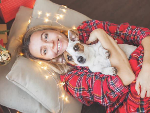 istock Happy woman on Christmas tree background 1345520816