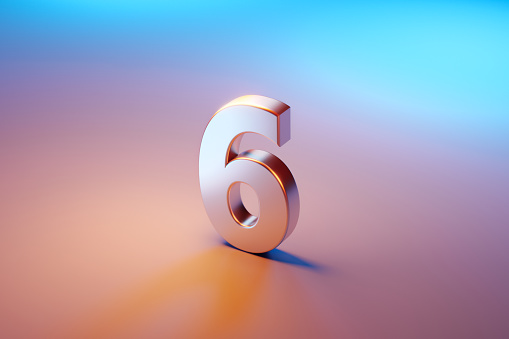 Number six sitting over pink and blue background. Selective focus. Horizontal composition with copy space. High angle view.