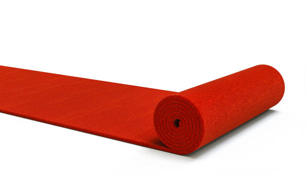 赤いカーペットは白い背景に展開します。 - unrolling ストックフォトと画像