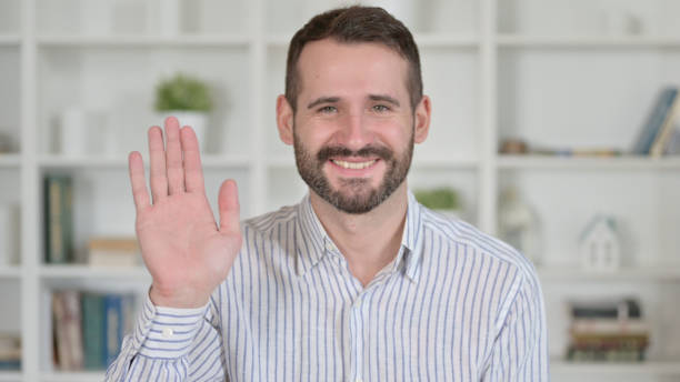 istock Portrait of Cheerful Young Man doing Video Chat 1345523535