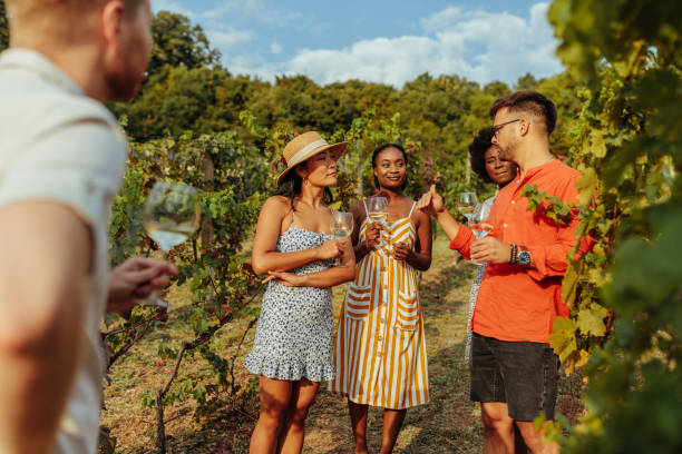 istock Young people tasting wine during wine tour 1345526156