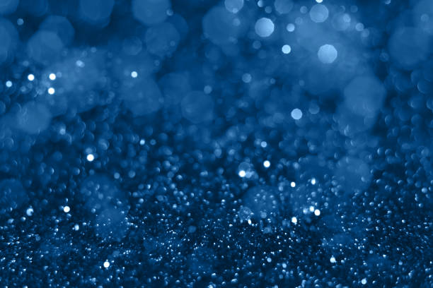 Blue glitter bokeh background Blue sparkling glitter bokeh background, christmas abstract defocused texture. Holiday lights royal blue stock pictures, royalty-free photos & images