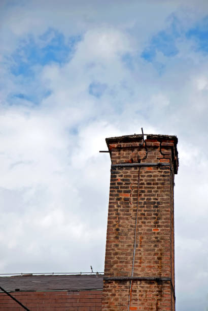istock Chimney of brick in a square shape 1345527319