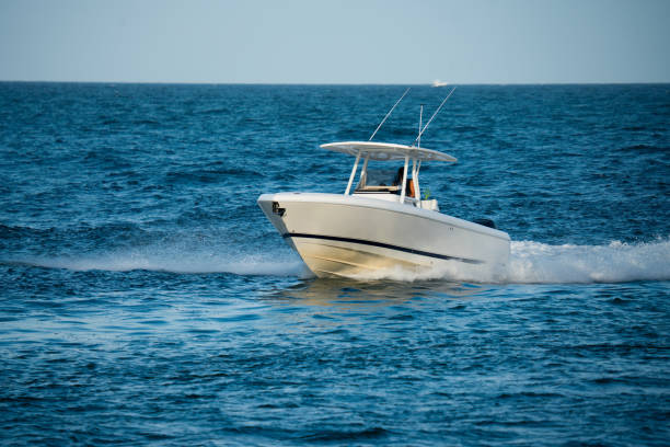 istock Small fishing boat navigating in open sea Miami Florida 1345529896