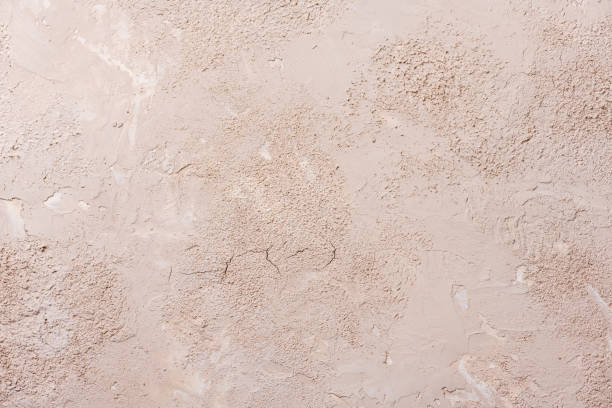 istock Grunge background with old stucco wall texture of beige color.