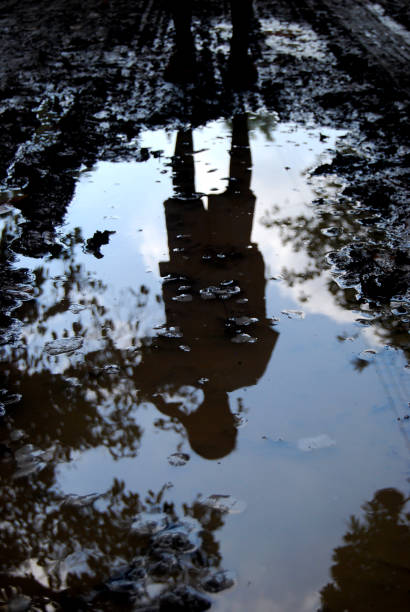 istock reflection of a child in muddy water 1345531889