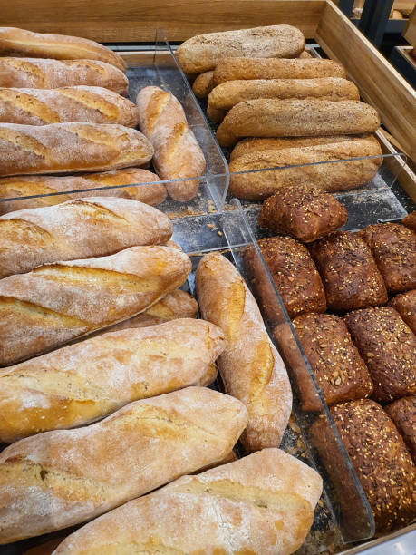 istock Different types of French baguettes in a bakery 1345533221