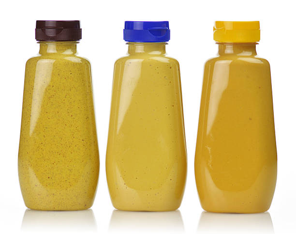 istock 3 plastic bottles of different mustards with colored tops 134553415