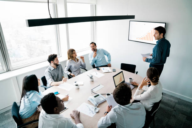 istock Businessman giving presentation to the team 1345535778