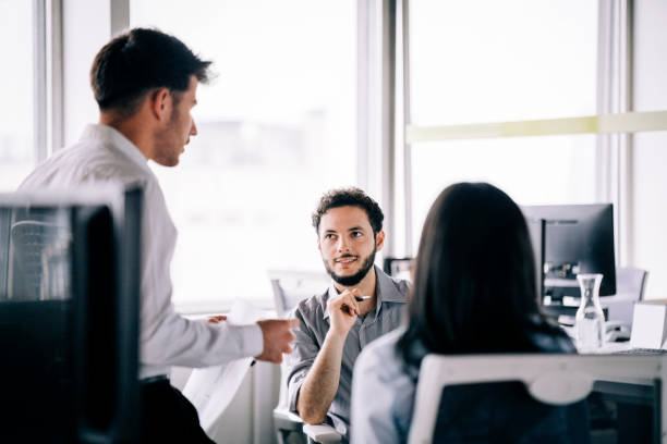 istock Business people having meeting at their desk 1345536073