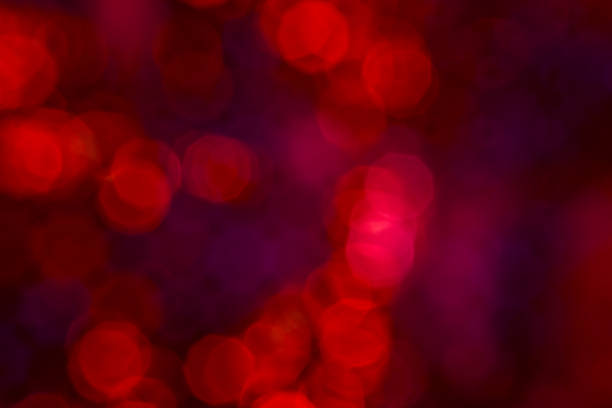 Abstract red backlight reflector and glitter bokeh lights background. Image is blurred. stock photo