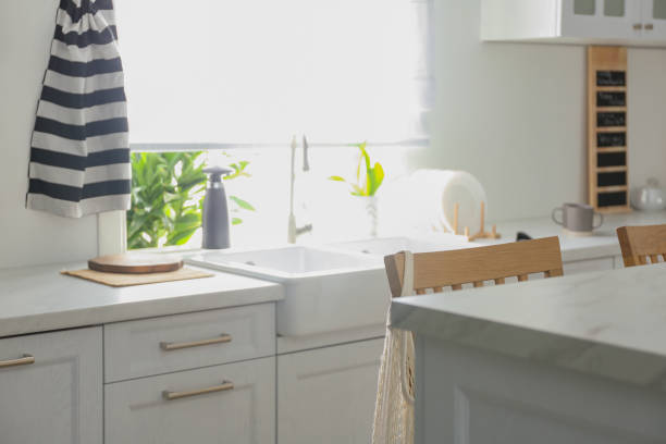 istock Modern kitchen interior with stylish white furniture 1345538025