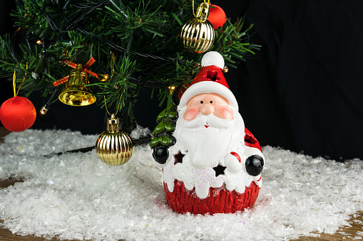 Close up view of cute gnome figure on christmas decoration background. Christmas holidays concept.