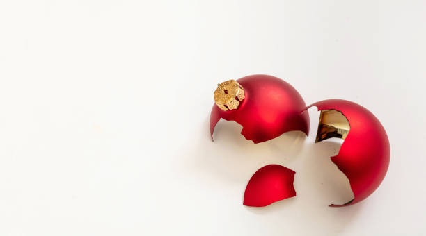 istock Red Christmas ball broken isolated on white background, closeup view 1345538627