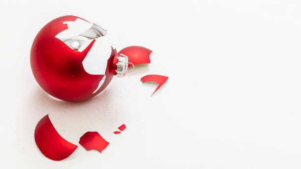 istock Red Christmas ball broken isolated on white background, closeup view 1345538656