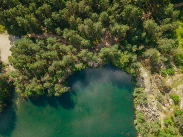 istock Career. Water-filled granite quarry. Aerial view. 1345539003