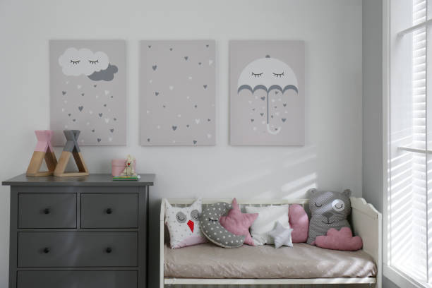 istock Baby room interior with cute posters and comfortable bed 1345539142