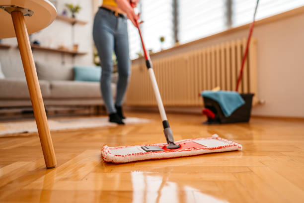 istock Cleaning parquet floor with wet mop 1345539958