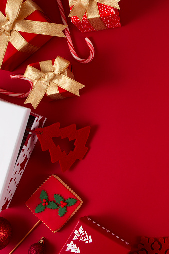 Christmas gift boxes on red background with copy space
