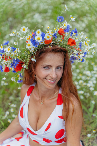 Flower wreath. Portrait of a woman with a floral wreath on her head.