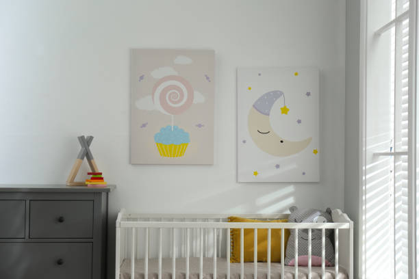istock Baby room interior with crib and cute posters on wall 1345540220