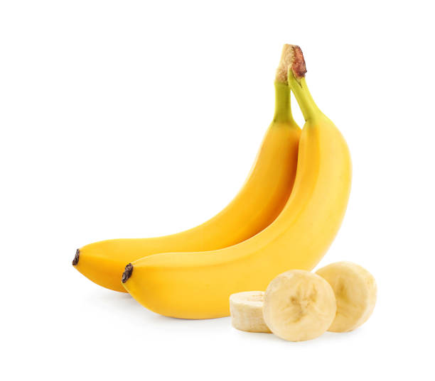 istock Delicious ripe bananas and pieces on white background 1345542758