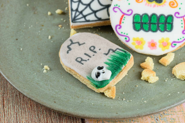 istock Selective focus, tombstone-shaped buttery biscuit closeup on a green plate. 1345545517