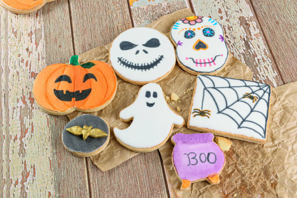 istock Several Halloween themed buttery cookies on brown paper (top view). 1345545920