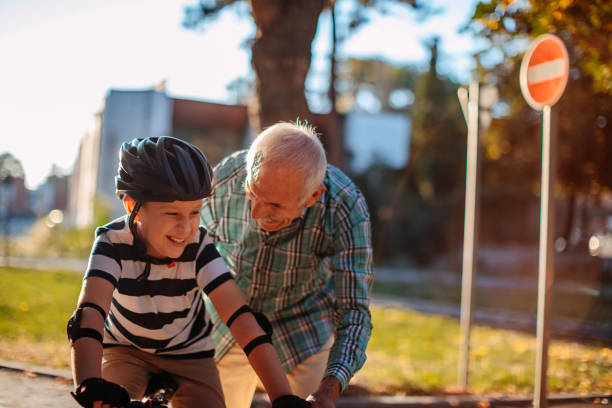 istock Child learning to ride bike 1345546520