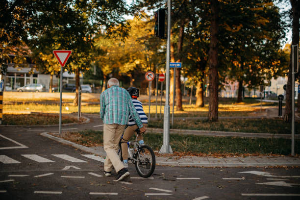 istock Child learning to ride bike 1345546554