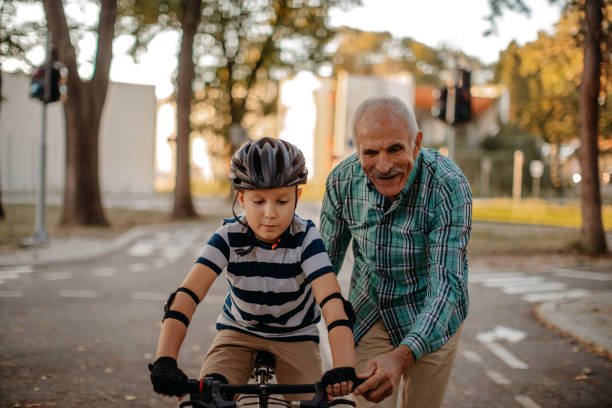 istock Child learning to ride bike 1345546555