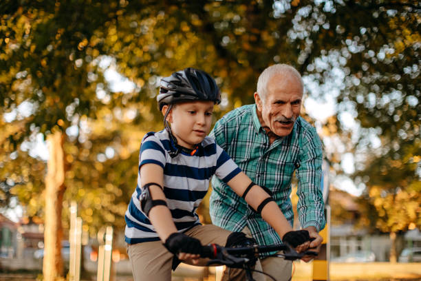 istock Child learning to ride bike 1345546558
