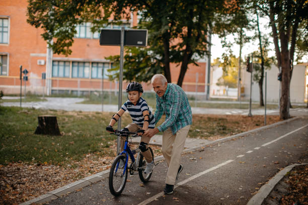 istock Child learning to ride bike 1345546582