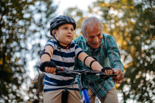 istock Child learning to ride bike 1345546604