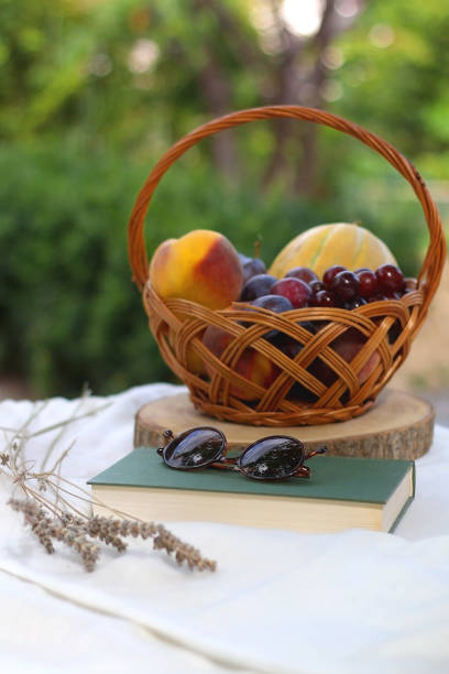 istock Fruit Basket, Book, Sunglasses and Lavender 1345547843