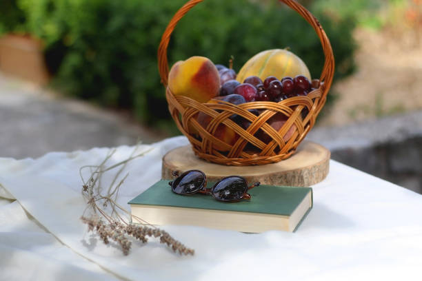 istock Fruit Basket, Book, Sunglasses and Lavender 1345547887