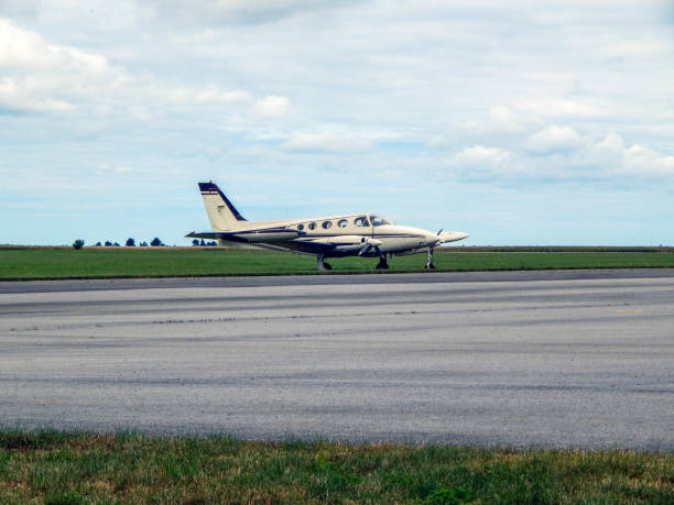 istock Plane parked by the side of the runway 1345549536