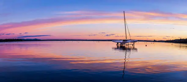 Trimaran dry docked on Brome Lake, eastern town ship,  at sunrise, Quebec Canada