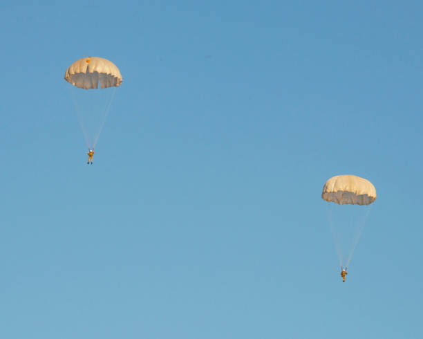 istock Skydiver activity sport jump on the blue sky background 1345550074